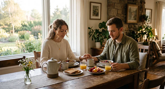 Christian family praying with grateful hearts before a meal